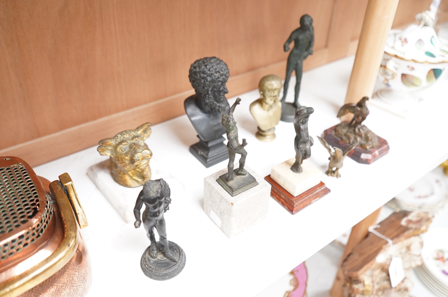 Italian grand tour souvenirs, 19th/20th century; nine small sculptures and busts, after the antique, the majority bronze and one depicting Lucius Verus, largest 19cm high